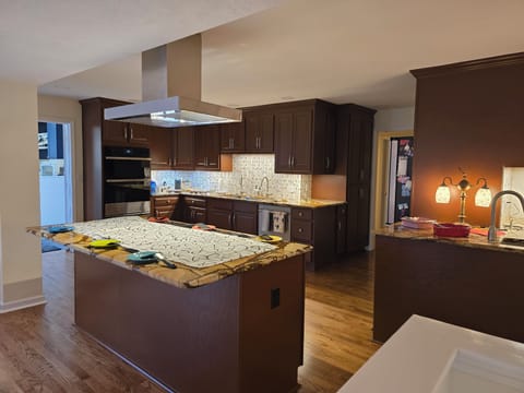 Kitchen. In this photo, induction cooktop is covered to use as a serving area.