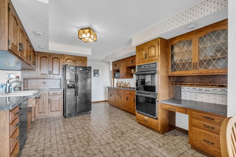 This kitchen is a time capsule of warmth and character, with enough space to feed the whole crew.