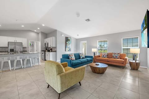 Open living room and kitchen with 65 inch flat screen smart TV, stong WiFi and fully-equipped kitchen with all major appliances.