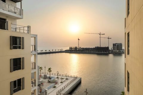 Stunning Sunset View: Relax on the balcony as the sun dips over Dubai`s skyline and waterfront!