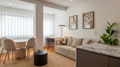 Spacious living area with natural light and a cozy sofa bed, perfect for relaxation. #comfortableliving #portoapartment #citystay