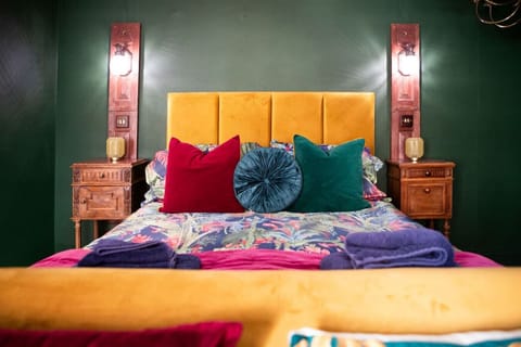 Bold bed frame and luxury bedding.