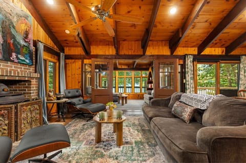 Rustic lounge with fireplace for relaxing.