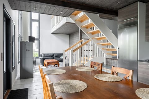 This cozy modern cabin is spread across two floors, offering a smart layout and comfortable sleeping arrangements for your stay.