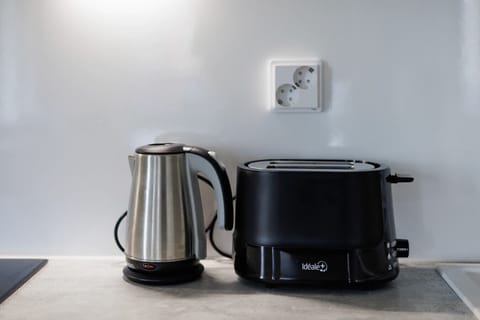 Modern kitchen essentials provided for your convenience, including a toaster and kettle.