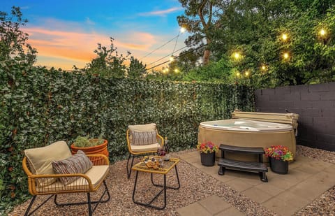 Sink into the warmth of your private hot tub as the sun sets - an intimate evening under glowing string lights made for quiet moments and connection.