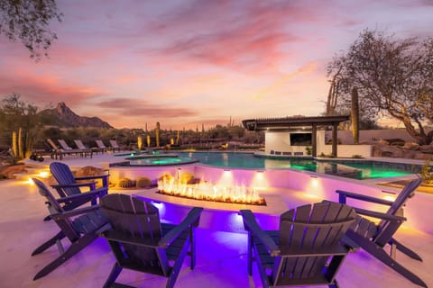 Enjoy cozy seating around the fire while soaking in incredible desert sunsets — the ultimate outdoor living experience.