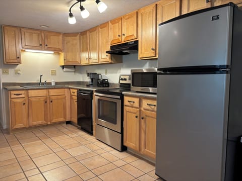 Alternate kitchen angle showing generous counter space & storage