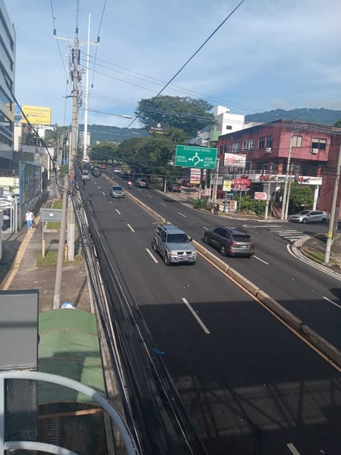 outside view of the main parking lot under the green sign