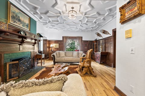 This warm and inviting living space blends historic character with cozy comfort.