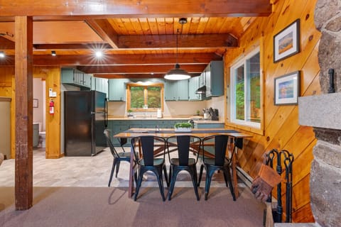 Share stories and meals at the wooden dining table.