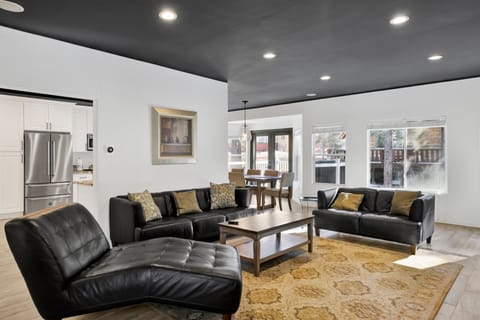 Cozy mountain living room with comfy seating, and smart TV—perfect for relaxing evenings, movie nights, and warm cabin vibes after outdoor adventures.