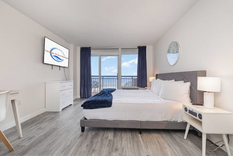 Wake up to postcard-worthy ocean views in a serene, coastal-chic bedroom