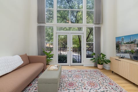 Bright space with soaring windows, lush views, and stylish decor awaits you!