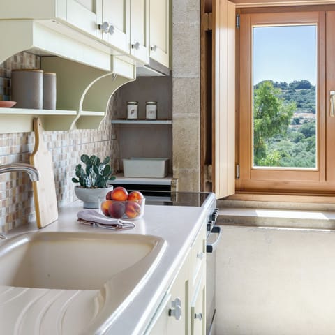 Fully equipped kitchen in apartment.