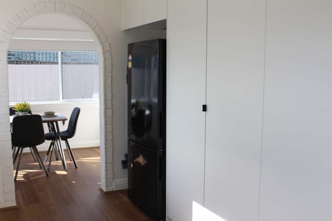 Large fridge, lovely arch to separate dining room