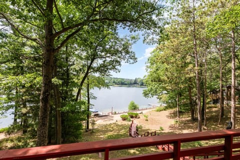 Step down into your very own private lakefront with sandy beach!
