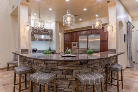 Curved counter offers bar seating for morning coffee, snacks and nightcaps.