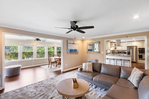 Open floor plan for the living room, kitchen and large sun room