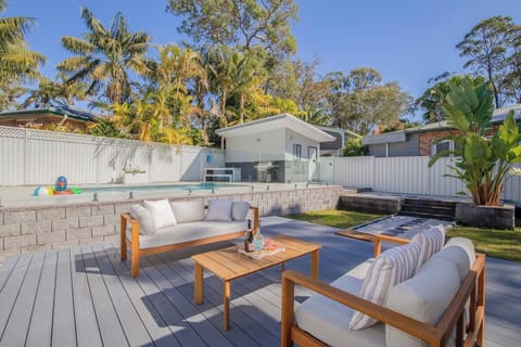 Relax and unwind on the deck, perfect for casual drinks or soaking up the sunshine by the pool.