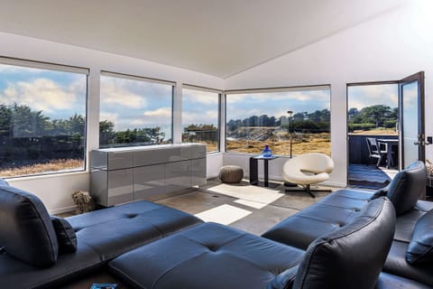 Second floor living room with panoramic views of the Pacific Ocean! 