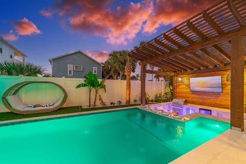 The ultimate vacation starts here—sip, swim, and unwind at the heated swim-up pool bar.