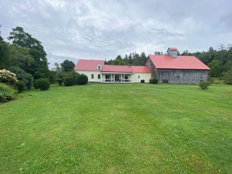 Side view from gardens, looking back at house and barn