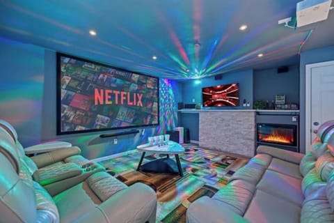 The ultimate entertainment room - a theater-style screen, karaoke, PS5