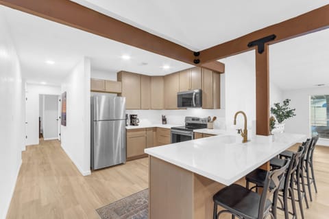 Kitchen provides ample counter space as well as extra seating