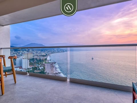 Spectacular sunset views over Banderas Bay from the private balcony. Watch the sky change colors while overlooking Puerto Vallarta's coastline and sparkling Pacific waters.