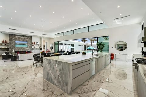 Chef’s kitchen with Miele appliances and imported finishes.