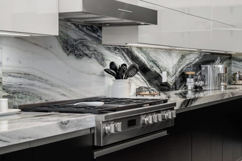 Features stainless steel appliances.