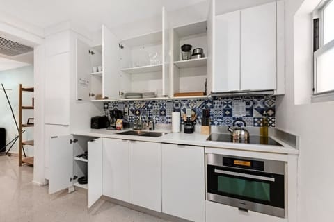 Experience gourmet living at the beautifully-designed kitchen of 250 Collins