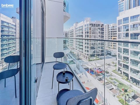Relax and soak in the atmosphere on this well-appointed balcony with a comfy seating area.