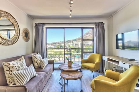 Beautiful natural light from the large glass balcony doors, with the mountain view in the background!