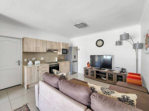 Living room area leading to kitchen