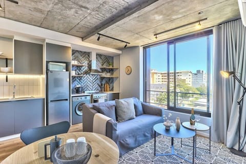 Sunny living room with large windows for that lovely sea breeze!