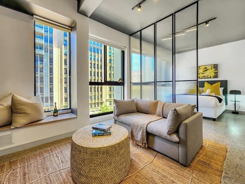 Gorgeous natural light, window nook to enjoy a good book, comfy sofa- leading to the bedroom
