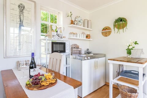 Compact kitchenette with essentials and dining table