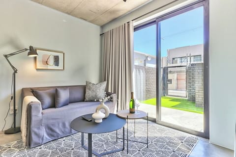 Open plan living room with small patio