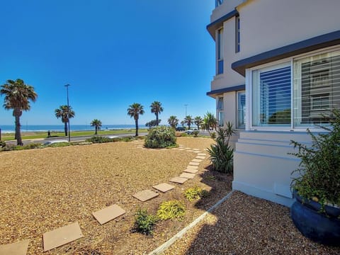 The exterior of the apartment building, showing you how close to the ocean you are