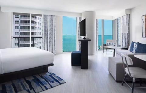 Wake up to sweeping bay views in a bright suite.