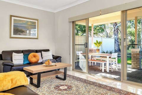 Move easily between the indoor area and the covered alfresco area, perfect for enjoying a morning coffee or sunset meal surrounded by native trees.