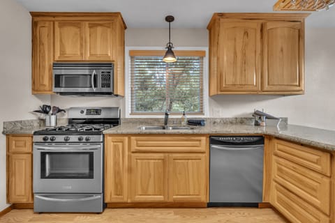 Spacious kitchen open kitchen has everything you need to cook for a hungry crew.  All stainless steel appliances.