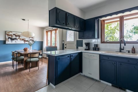 Bright dining area next to the kitchen, great for meals, catching up, or getting some work done.