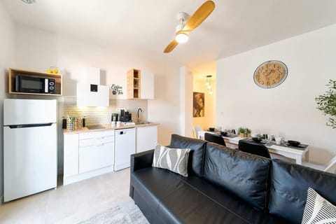 Open-plan kitchen, dining area and sofa bed which comfortably sleeps one adult.