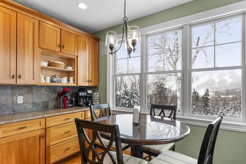 Breakfast nook right in the kitchen has seating for 4. Great spot for morning coffee with direct views of Mount Snow