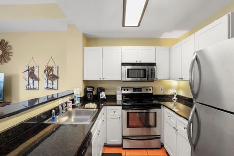 The full kitchen is stocked with pots, pans, and all the essentials—including a coffee maker, toaster, crock pot, and blender. It has everything you'd expect at home, so you can prepare meals in-house and save money during your stay.