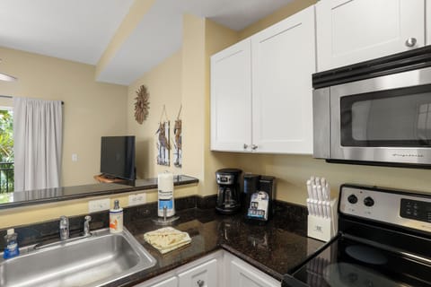 "The kitchen includes both a traditional coffee maker and a pod-style machine, giving you options for your morning brew.”