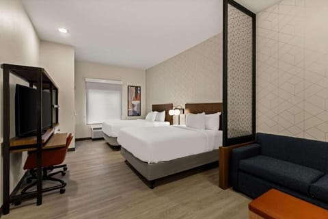 Unwind in a bright, spacious room with plush beds.